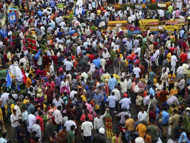 People crowd at a wholesale market as they shop for flowers on the occasion of Ugadi in Bangalore. (AP)
