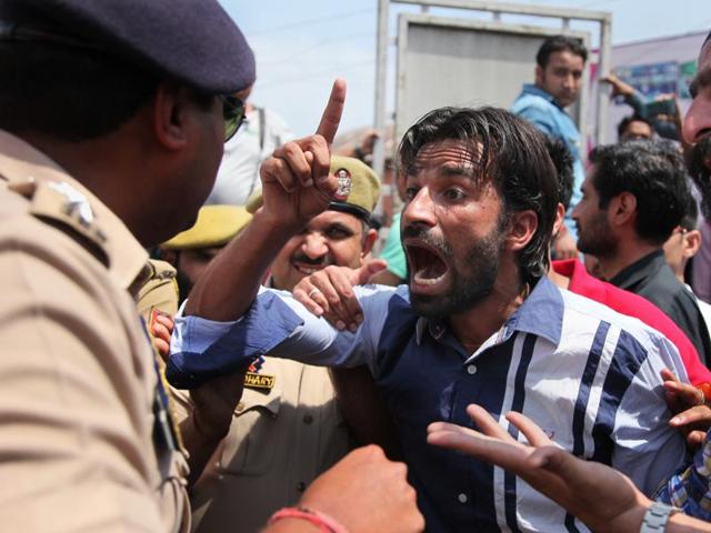 Students argue with a policeman during a protest against police action on students of National Institute of Technology (NIT) in Srinagar while they were protesting against students of Kashmiri origin celebrating India's loss to West Indies in the semifinal of the ICC T20 World Cup. (AP Photo) Students argue with a policeman during a protest against police action on students of National Institute of Technology (NIT) in Srinagar while they were protesting against students of Kashmiri origin celebrating India's loss to West Indies in the semifinal of the ICC T20 World Cup. (AP Photo)