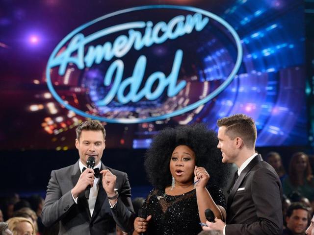 Popular American music talent hunt television series, American Idol, had its final show on Thursday in Los Angeles, California amid much fanfare and emotional moments. (L-R) Host Ryan Seacrest and finalists La'Porsha Renae and Trent Harmon speak onstage during FOX's American Idol Finale For The Farewell Season on April 7, 2016 in Hollywood, California. (AFP)