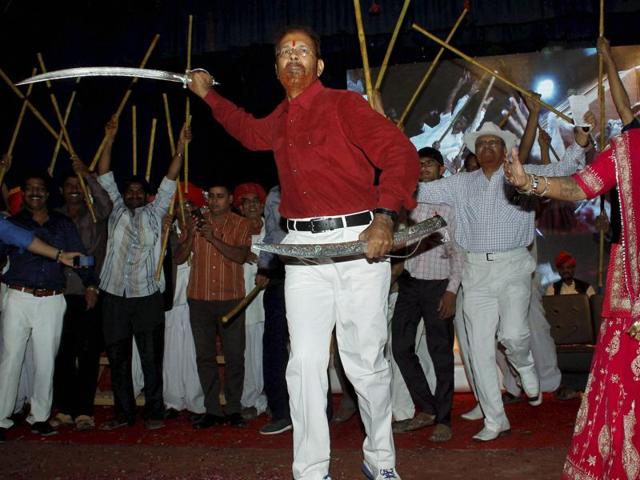 Retired IPS officer D G Vanzara dances with a sword during a welcome ceremony by his community in Gandhinagar on Friday, April 8, 2016.(PTI)