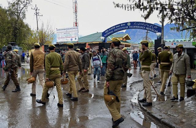 Police and CRPF personnel deployed at National Institute of Technology (NIT) following tensions between the local and non-local students of the institute in Srinagar. (PTI) Police and CRPF personnel deployed at National Institute of Technology (NIT) following tensions between the local and non-local students of the institute in Srinagar. (PTI)
