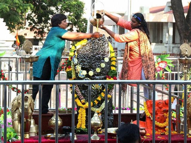 A day after the Shri Shaneshwar Devasthan (Shani Shingnapur Temple) Trust’s historic vote for gender equality, thousands of women from different parts of Maharashtra thronged to worship Lord Shanidev on Saturday, officials said. (PTI) A day after the Shri Shaneshwar Devasthan (Shani Shingnapur Temple) Trust’s historic vote for gender equality, thousands of women from different parts of Maharashtra thronged to worship Lord Shanidev on Saturday, officials said. (PTI)