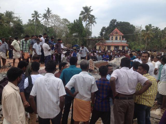 Local residents gather at the Puttingal Devi temple in Paravur, Kerala. (HT Photo) Local residents gather at the Puttingal Devi temple in Paravur, Kerala. (HT Photo)