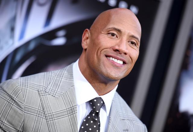 Dwayne Johnson (file photo) and Kevin Hart hosted the show, opening it Mad Max style by riding through Warner Bros. Studios strapped to the front of a tricked-out truck. (AP)