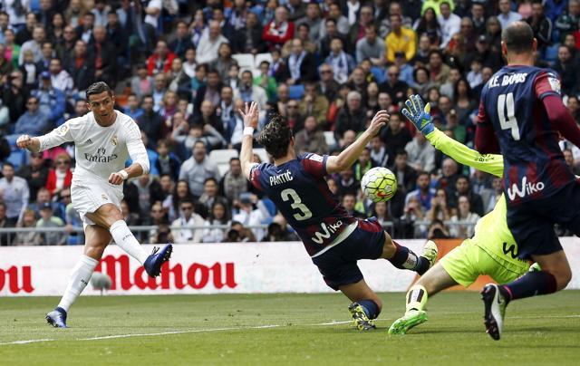 Cristiano Ronaldo scores the third goal for Real Madrid. (REUTERS) Cristiano Ronaldo scores the third goal for Real Madrid. (REUTERS)