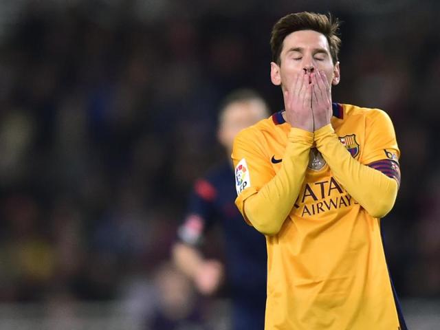 Barcelona's Lionel Messi walks off the pitch as Real Sociedad players celebrate their win. (AP) Barcelona's Lionel Messi walks off the pitch as Real Sociedad players celebrate their win. (AP)