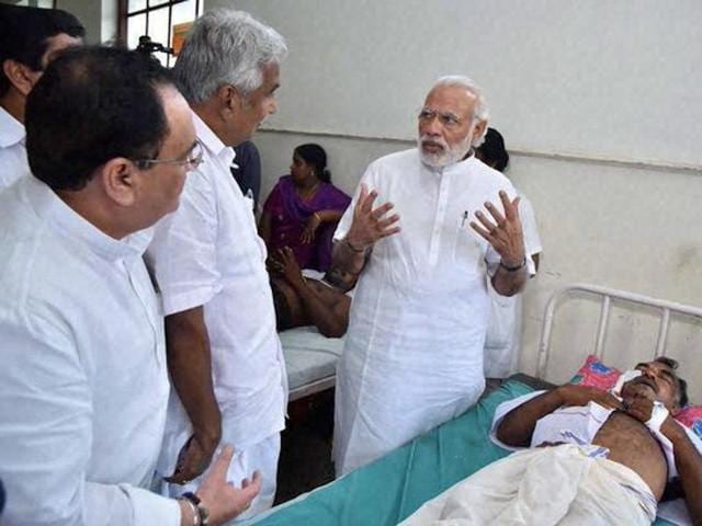 Prime Minister Narendra Modi visits a hospital to meet the victims of a fire tragedy at a temple Kerala’s Kollam. (PTI) Prime Minister Narendra Modi visits a hospital to meet the victims of a fire tragedy at a temple Kerala’s Kollam. (PTI)