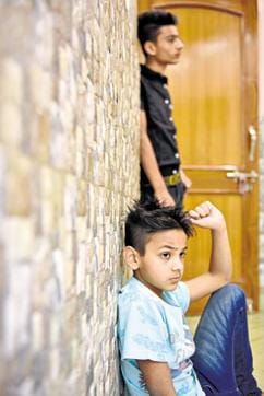 Kaif (sitting) with his brother Fahad. Both saw their father being beaten to death on April 5, 2015. (Saumya Khandelwal/HT Photo)