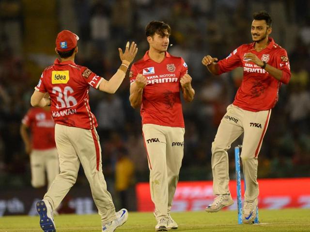 Kings XI Punjab Marcus Stoinis (C) celebrates with teammates after dismissing Gujarat Lions team captain Suresh Raina. (AFP Photo) 