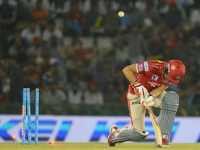 Kings XI Punjab batsman David Miller is bowled by Gujarat Lions Dwayne Bravo. (AFP Photo) 