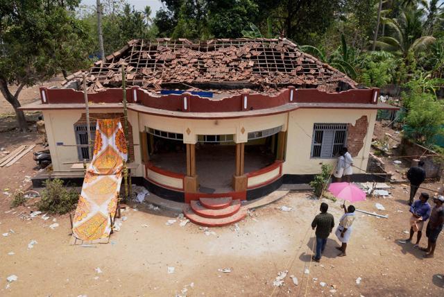 View of a damaged building after a fire broke out during a fireworks display in Paravur, Kerala. (PTI Phoot) View of a damaged building after a fire broke out during a fireworks display in Paravur, Kerala. (PTI Phoot)