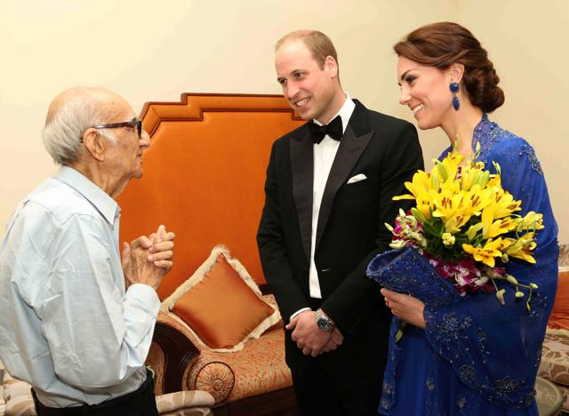 Prince William and his wife Catherine, Duchess of Cambridge speak with Boman Kohinoor (L) during a meeting in Mumbai. Kohinoor, 93, has a strong claim to be India's biggest fan of the British royal family -- giant cardboard cutouts of William and Kate adorn his restaurant -- and he told AFP that he was desperate to meet them. (AFP PHOTO/ BRITISH DEPUTY HIGH COMMISSION )