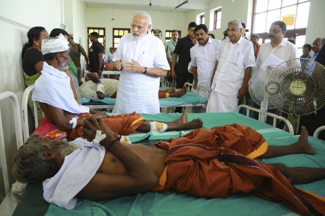 Prime Minister Narendra Modi visits the injured victims at the Kollam district hospital. (AP Photo) Prime Minister Narendra Modi visits the injured victims at the Kollam district hospital. (AP Photo)