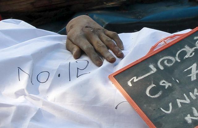 The hand of a devotee who died when a fire broke out at the Puttingal Devi temple, is seen outside the mortuary of a hospital in Kollam, Kerala. (Reuters Photo) The hand of a devotee who died when a fire broke out at the Puttingal Devi temple, is seen outside the mortuary of a hospital in Kollam, Kerala. (Reuters Photo)
