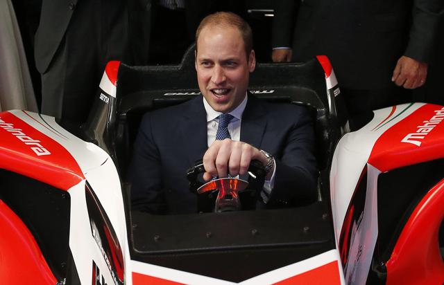 Britain's Prince William drives a Formula E simulator at an event on young entrepreneurs in Mumbai. (AP Photo)