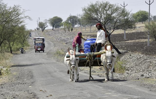 Villagers of Hassegoan carry water tank on a bullock cart, to get water from bore-well in farms which are 10 -12 kms away from their house, in Latur. (Anshuman Poyrekar/HT Photo) Villagers of Hassegoan carry water tank on a bullock cart, to get water from bore-well in farms which are 10 -12 kms away from their house, in Latur. (Anshuman Poyrekar/HT Photo)