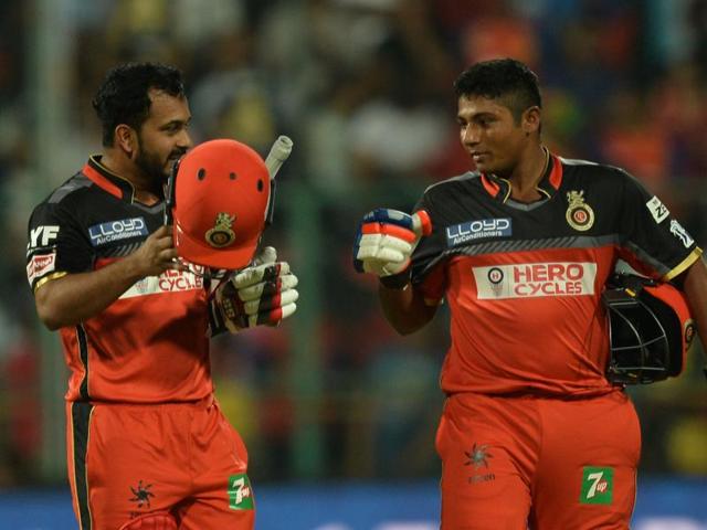 Sarfaraz Khan (R) congratulates Kedar Jadhav at the end of the first innings. Sarfaraz played a blinder, hitting 35 off 10 balls to help Royal Challengers Bangalore post 227/4. (AFP) Sarfaraz Khan (R) congratulates Kedar Jadhav at the end of the first innings. Sarfaraz played a blinder, hitting 35 off 10 balls to help Royal Challengers Bangalore post 227/4. (AFP)