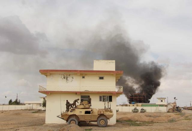 Smoke billows from a building after a Taliban attack in Gereshk district of Helmand province of Afghanistan on Tuesday. (Reuters file) Smoke billows from a building after a Taliban attack in Gereshk district of Helmand province of Afghanistan on Tuesday. (Reuters file)