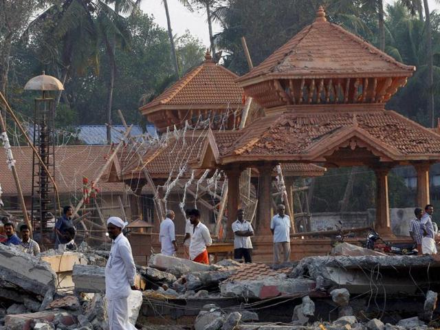 Footwear of the devotees lie scattered inside the Puttingal temple compound where a massive fire broke out during a fireworks display on Sunday. (AP) Footwear of the devotees lie scattered inside the Puttingal temple compound where a massive fire broke out during a fireworks display on Sunday. (AP)