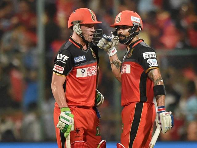Virat Kohli and AB De Villiers share a word during their innings. (PTI) Virat Kohli and AB De Villiers share a word during their innings. (PTI)