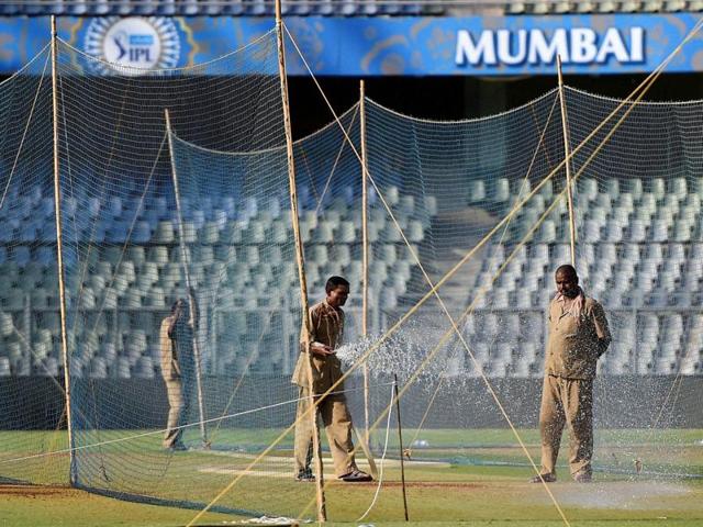 Groundsmen water the pitch at the Wankhede stadium ahead of IPL matches in Mumbai on Wednesday, April 6, 2016, ahead of the start of season 9 of IPL. (PTI) Groundsmen water the pitch at the Wankhede stadium ahead of IPL matches in Mumbai on Wednesday, April 6, 2016, ahead of the start of season 9 of IPL. (PTI)