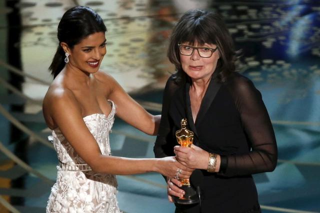 Margaret Sixel accepts the award for Best Film Editing for Mad Max: Fury Road from Priyanka Chopra at the 88th Academy Awards in Hollywood, California February 28. (REUTERS) Margaret Sixel accepts the award for Best Film Editing for Mad Max: Fury Road from Priyanka Chopra at the 88th Academy Awards in Hollywood, California February 28. (REUTERS)