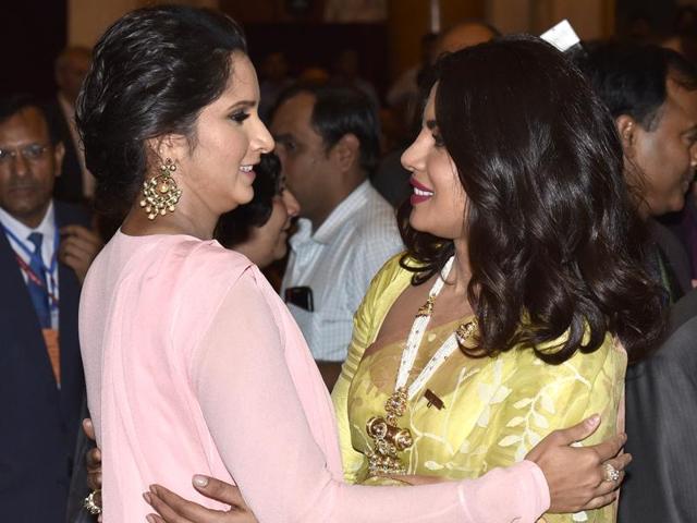 Sania and Priyanka greet each other before receiving their awards. (Arvind Yadav/HT Photo) Sania and Priyanka greet each other before receiving their awards. (Arvind Yadav/HT Photo)