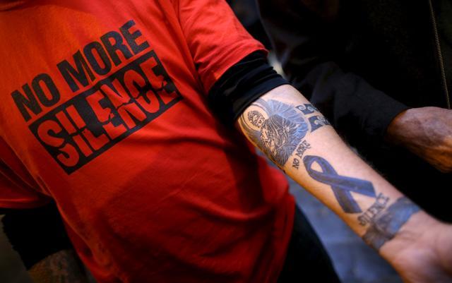 A child sex abuse victim wears a t-shirt that says "no more silence" and shows a tattoo on his arm as he stands in front of the Quirinale hotel in Rome in February. (REUTERS) A child sex abuse victim wears a t-shirt that says "no more silence" and shows a tattoo on his arm as he stands in front of the Quirinale hotel in Rome in February. (REUTERS)