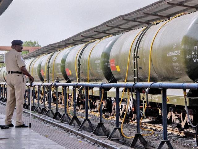 A policeman stand guards a Central Railway train loading water to transport to drought affected Latur District from Miraj station near Sangli on Sunday. (PTI Photo) A policeman stand guards a Central Railway train loading water to transport to drought affected Latur District from Miraj station near Sangli on Sunday. (PTI Photo)