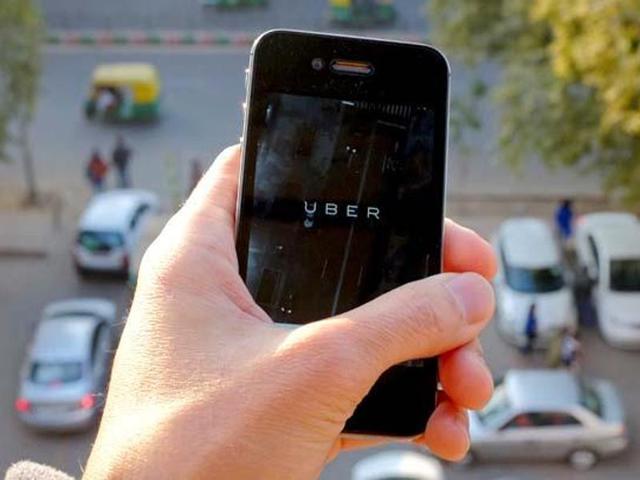 The logo of car-sharing service app Uber on a smartphone over a reserved lane for taxis in a street is seen in this photo illustration. (Reuters File Photo) The logo of car-sharing service app Uber on a smartphone over a reserved lane for taxis in a street is seen in this photo illustration. (Reuters File Photo)