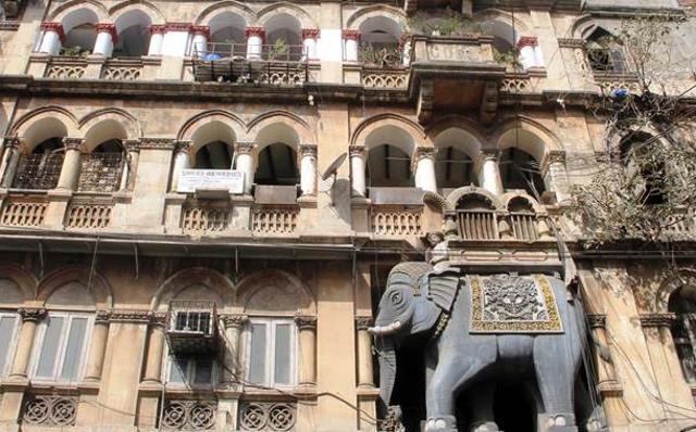 Bhangwadi, further ahead of the Round Building, sees Hindu architecture with an enormous elephant mounted at the entrance. It is possibly called so because of the Shiv temple built inside the settlement. The name could also have originated from bhang (opium) as the Parsis community resided in the wadi and traded in bhang or opium with China from here. (Photo: Bhushan Koyande) Bhangwadi, further ahead of the Round Building, sees Hindu architecture with an enormous elephant mounted at the entrance. It is possibly called so because of the Shiv temple built inside the settlement. The name could also have originated from bhang (opium) as the Parsis community resided in the wadi and traded in bhang or opium with China from here. (Photo: Bhushan Koyande)