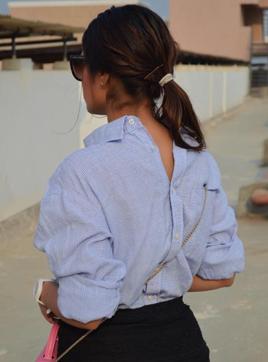 Wearing a button down shirt backwards has been a huge street style trend internationally(Photo: Shitiz Ruhail)