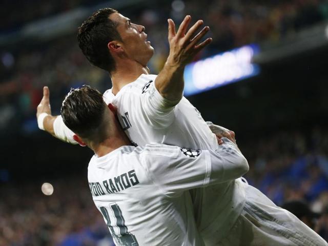 Real Madrid's Cristiano Ronaldo takes a free kick against German side Wolfsburg in the Champions League quarterfinal match.(Reuters Photo)