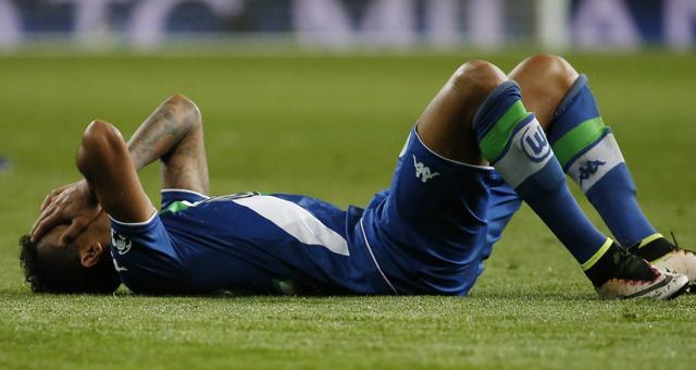 Wolfsburg's Luiz Gustavo looks dejected at the end of the game. (Reuters Photo)