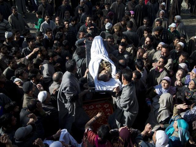 Kashmiri Muslims carry the body of Raja Begum, a 70-year-old woman, who was hit by gunfire on Tuesday, during her funeral procession in Langate some 75 km  north of Srinagar on Wednesday.  (AP) 