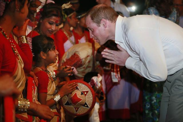 Prince William greets an Assamese dancer at the Kaziranga National Park. (AP Photo) Prince William greets an Assamese dancer at the Kaziranga National Park. (AP Photo)