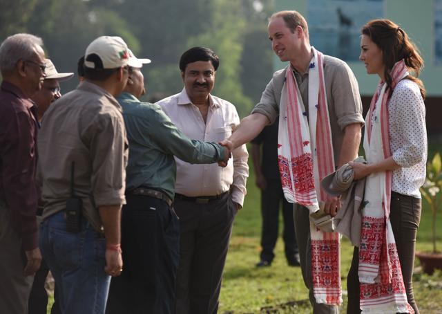 Before hopping on to the Gypsy, the couple were welcomed by the park officials with a gift of traditional Assamese shawls. (AFP Photo) Before hopping on to the Gypsy, the couple were welcomed by the park officials with a gift of traditional Assamese shawls. (AFP Photo)