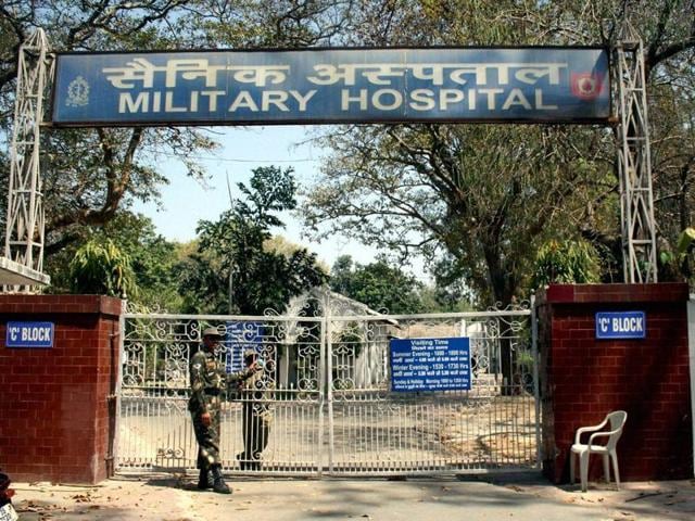Army personnel stand guard at a military hospital where a leopard was spotted in Meerut on Tuesday. (PTI photo) Army personnel stand guard at a military hospital where a leopard was spotted in Meerut on Tuesday. (PTI photo)