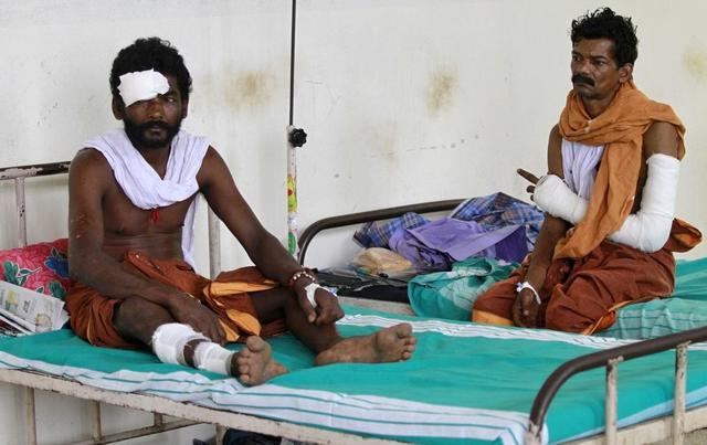 Men who were injured in a fire at the Puttingal Devi temple, rest in beds inside a hospital ward in Kollam. (Reuters Photo) Men who were injured in a fire at the Puttingal Devi temple, rest in beds inside a hospital ward in Kollam. (Reuters Photo)