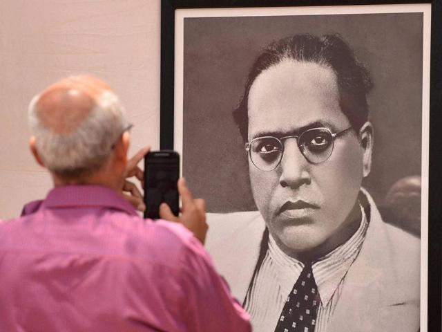 A man clicks a photo of BR Ambedkar's portrait outside 'Chaitya Bhoomi' on the occasion of his 125th birth anniversary in Mumbai on Thursday. (PTI) A man clicks a photo of BR Ambedkar's portrait outside 'Chaitya Bhoomi' on the occasion of his 125th birth anniversary in Mumbai on Thursday. (PTI)