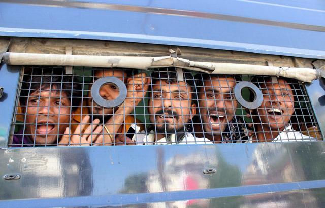 Police detain Bajrang Dal acitivists who hurled slipper at Kanhaiya Kumar. (PTI) Police detain Bajrang Dal acitivists who hurled slipper at Kanhaiya Kumar. (PTI)