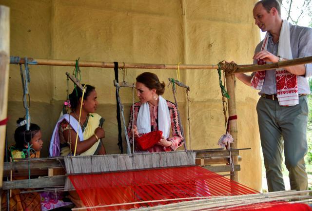 A woman speaks with Duchess Catherine after presenting a handloom cloth to her as Prince William looks on in Panbari village in Kaziranga, Assam. (REUTERS) A woman speaks with Duchess Catherine after presenting a handloom cloth to her as Prince William looks on in Panbari village in Kaziranga, Assam. (REUTERS)