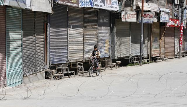 A boy is seen riding a bicycle during restrictions imposed by police in Mausuma area of Srinagar. (Waseem Andrabi/HT Photo) A boy is seen riding a bicycle during restrictions imposed by police in Mausuma area of Srinagar. (Waseem Andrabi/HT Photo)