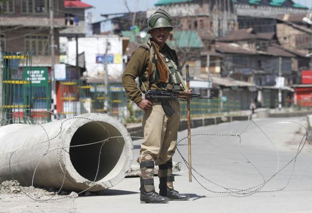 A soldier stands guard at the Downtown area of Srinagar district. (Waseem Andrabi/HT Photo) A soldier stands guard at the Downtown area of Srinagar district. (Waseem Andrabi/HT Photo)