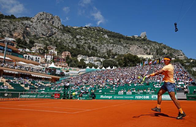 Rafael Nadal hits a forehand to Aljaz Bedene of Britain. (REUTERS)