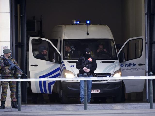 Police officers arrive aboard a vehicle at Brussels courthouse on April 13, 2016, before the hearing of top Paris attacks suspect Mohamed Abrini. (AFP) Police officers arrive aboard a vehicle at Brussels courthouse on April 13, 2016, before the hearing of top Paris attacks suspect Mohamed Abrini. (AFP)