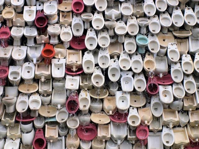 Toilets: A Spotter’s Guide fills 128 pages of outhouses, futuristic bathrooms, architectural marvels and sky-high urinals. In this photo, toilet waterfall in Foshan, China.(?Al Sol/500px)