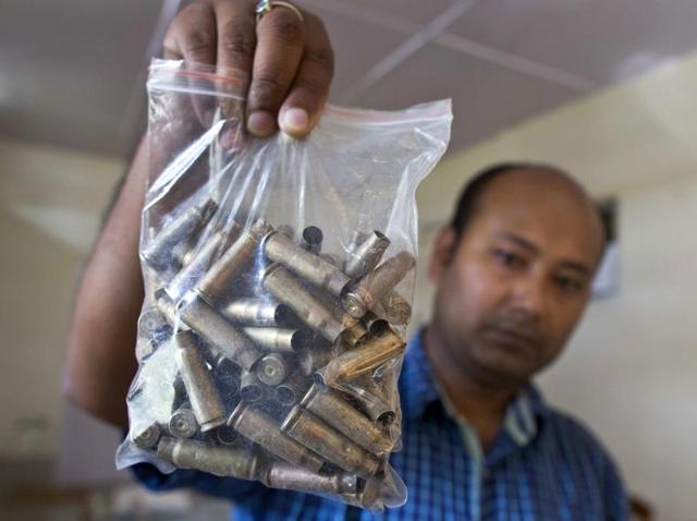 A forest official shows shell casings that were recovered from a site where a rhinoceros was killed by poachers with AK-47 at Kaziranga, India, Thursday, April 14, 2016. (AP Photo) A forest official shows shell casings that were recovered from a site where a rhinoceros was killed by poachers with AK-47 at Kaziranga, India, Thursday, April 14, 2016. (AP Photo)