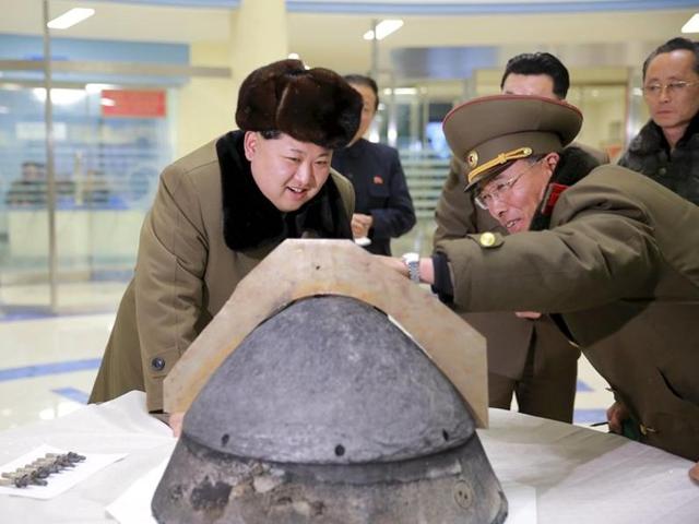 North Korean leader Kim Jong Un looks at a rocket warhead tip after a simulated test of atmospheric re-entry of a ballistic missile, at an unidentified location in this undated file photo released by North Korea's Korean Central News Agency (KCNA) in Pyongyang on March 15, 2016. (REUTERS)