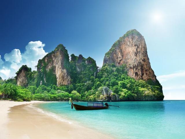 Railay Bay, Thailand: With colourful long-tail boats pulled up on the golden sand and jungly cliffs looming above, exotic photo-ops are everywhere. Adding to the mystique? It’s accessible only by boat. Plus, right on Railay is the Rayavadee Resort, covered in palm trees and tropical blooms, with two-story teak-filled bungalows. (Shutterstock) Railay Bay, Thailand: With colourful long-tail boats pulled up on the golden sand and jungly cliffs looming above, exotic photo-ops are everywhere. Adding to the mystique? It’s accessible only by boat. Plus, right on Railay is the Rayavadee Resort, covered in palm trees and tropical blooms, with two-story teak-filled bungalows. (Shutterstock)